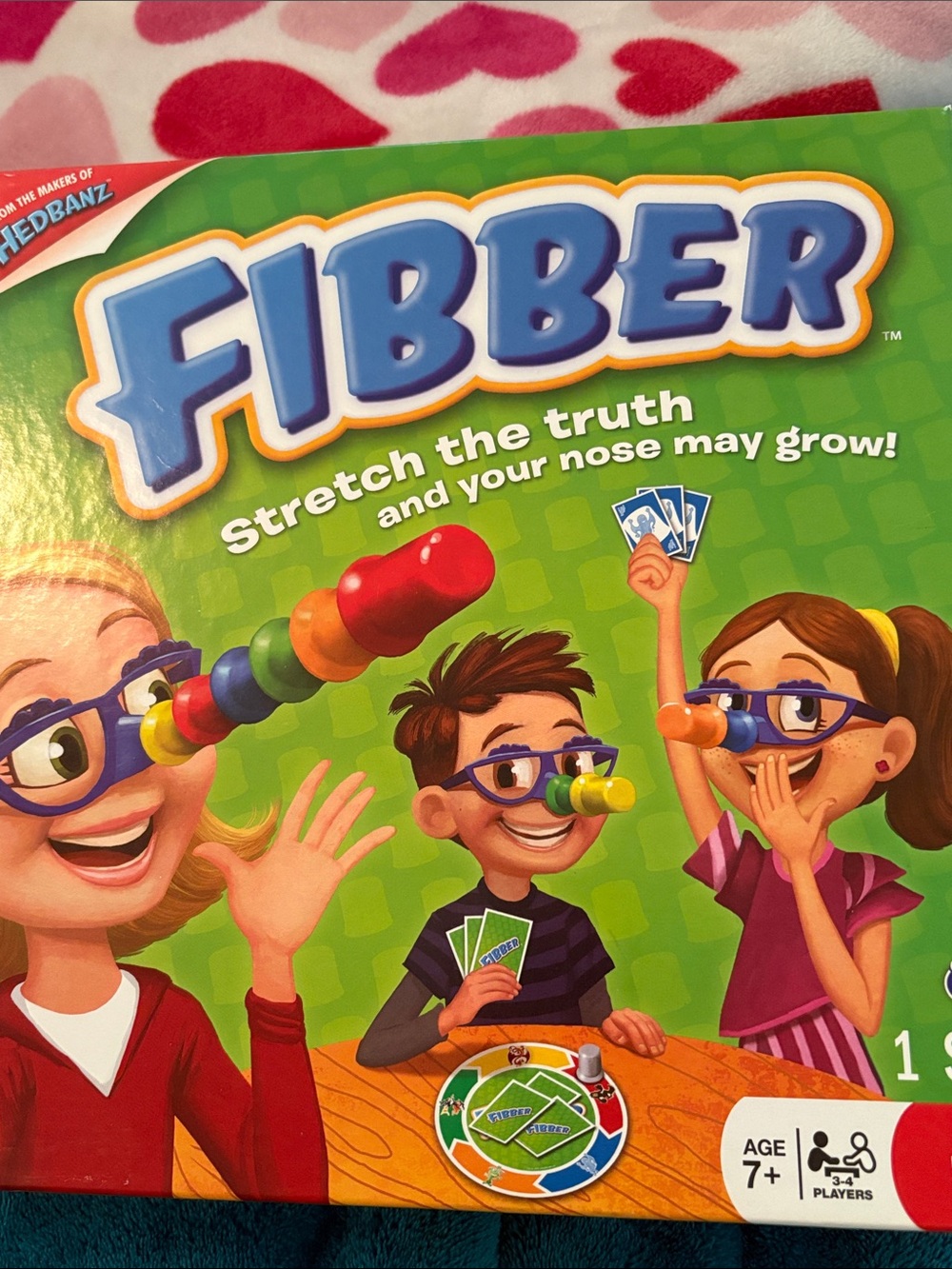 Fibber Family Game Night — Green Box with Colorful Nose Pieces